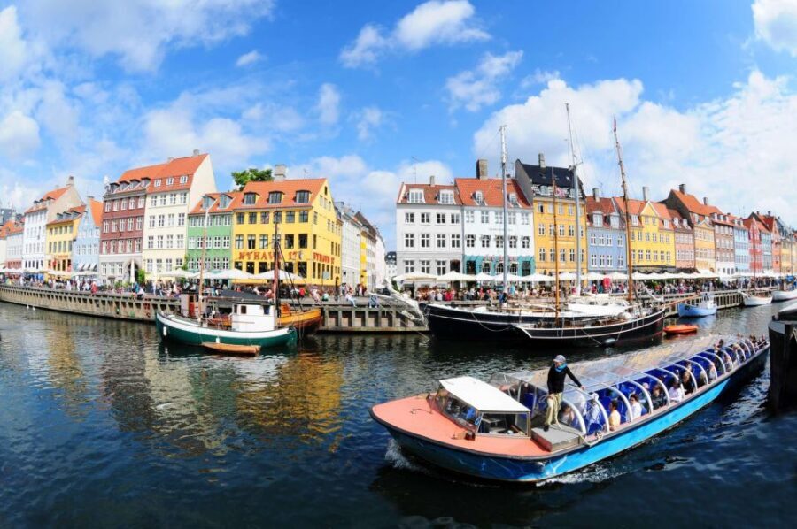 Copenhagen: Canal Boat Cruise & Old Town/Nyhavn Walking Tour - Legends and fairy-tale energy as you head toward Nyhavn